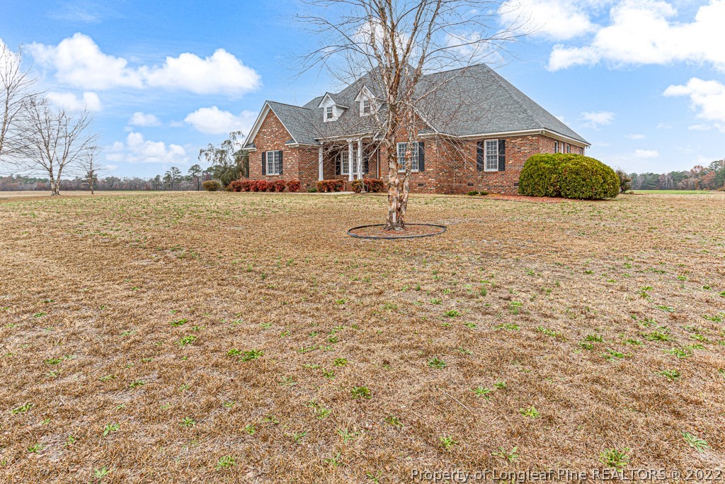 4051 Mt Tabor Road Red Springs, NC 28377 - Photo 3 of 50 a front view of a house with a yard