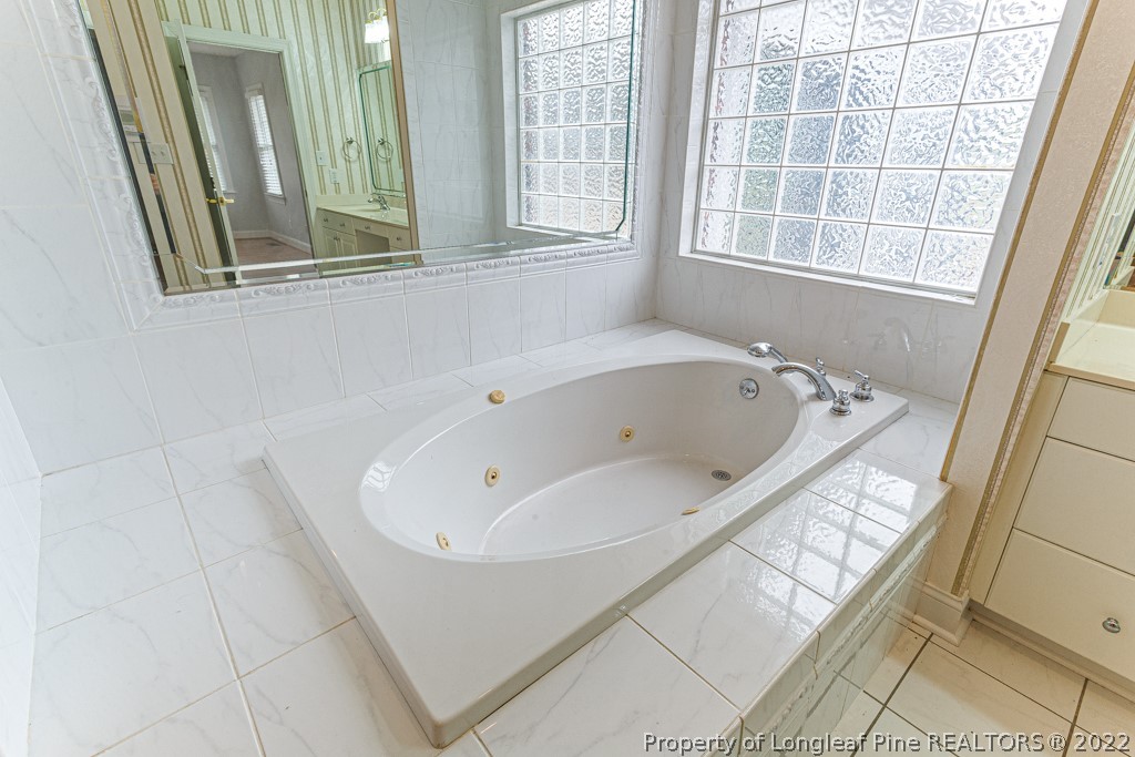 4051 Mt Tabor Road Red Springs, NC 28377 - Photo 32 of 50 a bathroom with a bathtub and a shower