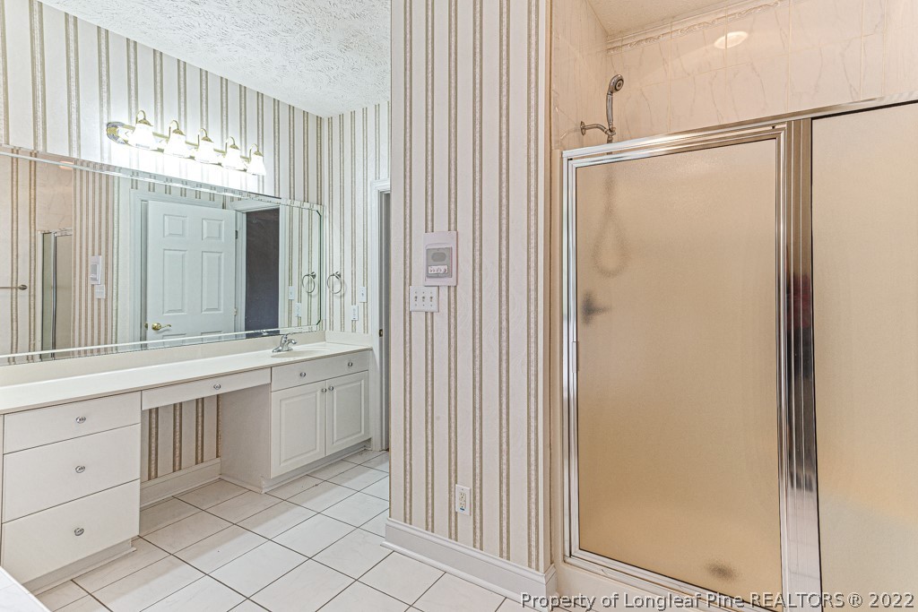 4051 Mt Tabor Road Red Springs, NC 28377 - Photo 33 of 50 a bathroom with a double vanity sink and a mirror