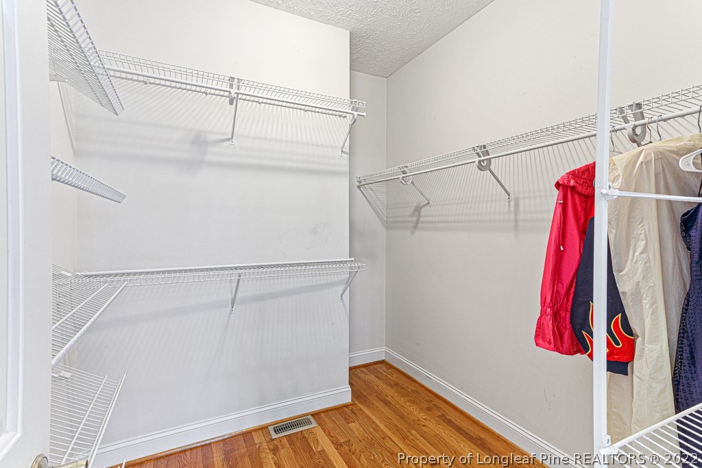4051 Mt Tabor Road Red Springs, NC 28377 - Photo 34 of 50 a view of walk in closet with clothes