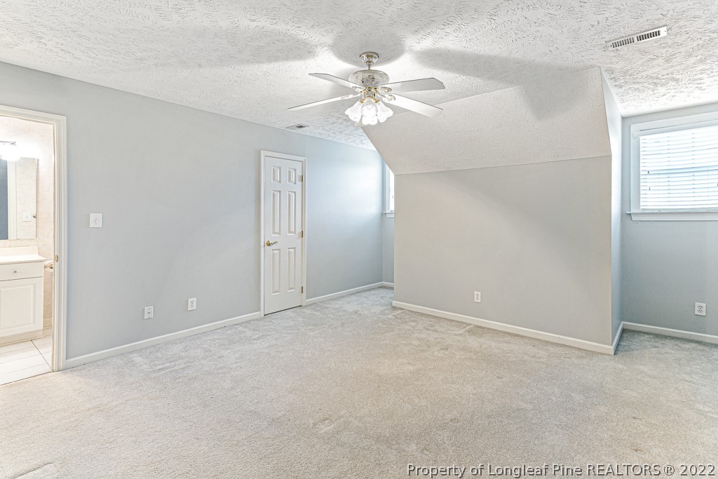 4051 Mt Tabor Road Red Springs, NC 28377 - Photo 36 of 50 an empty room with windows and fan