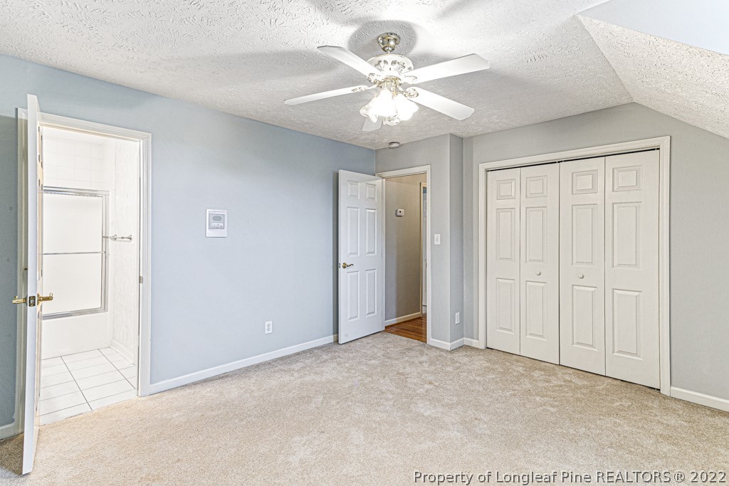 4051 Mt Tabor Road Red Springs, NC 28377 - Photo 39 of 50 a view of an empty room with a chandelier fan