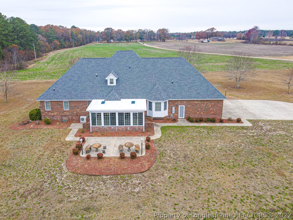 4051 Mt Tabor Road Red Springs, NC 28377 - Photo 44 of 50 an aerial view of a house with a yard
