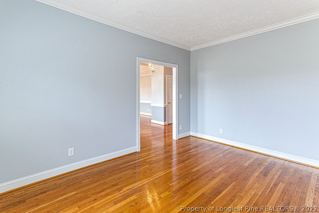4051 Mt Tabor Road Red Springs, NC 28377 - Photo 10 of 50 a view of an empty room with wooden floor and a window