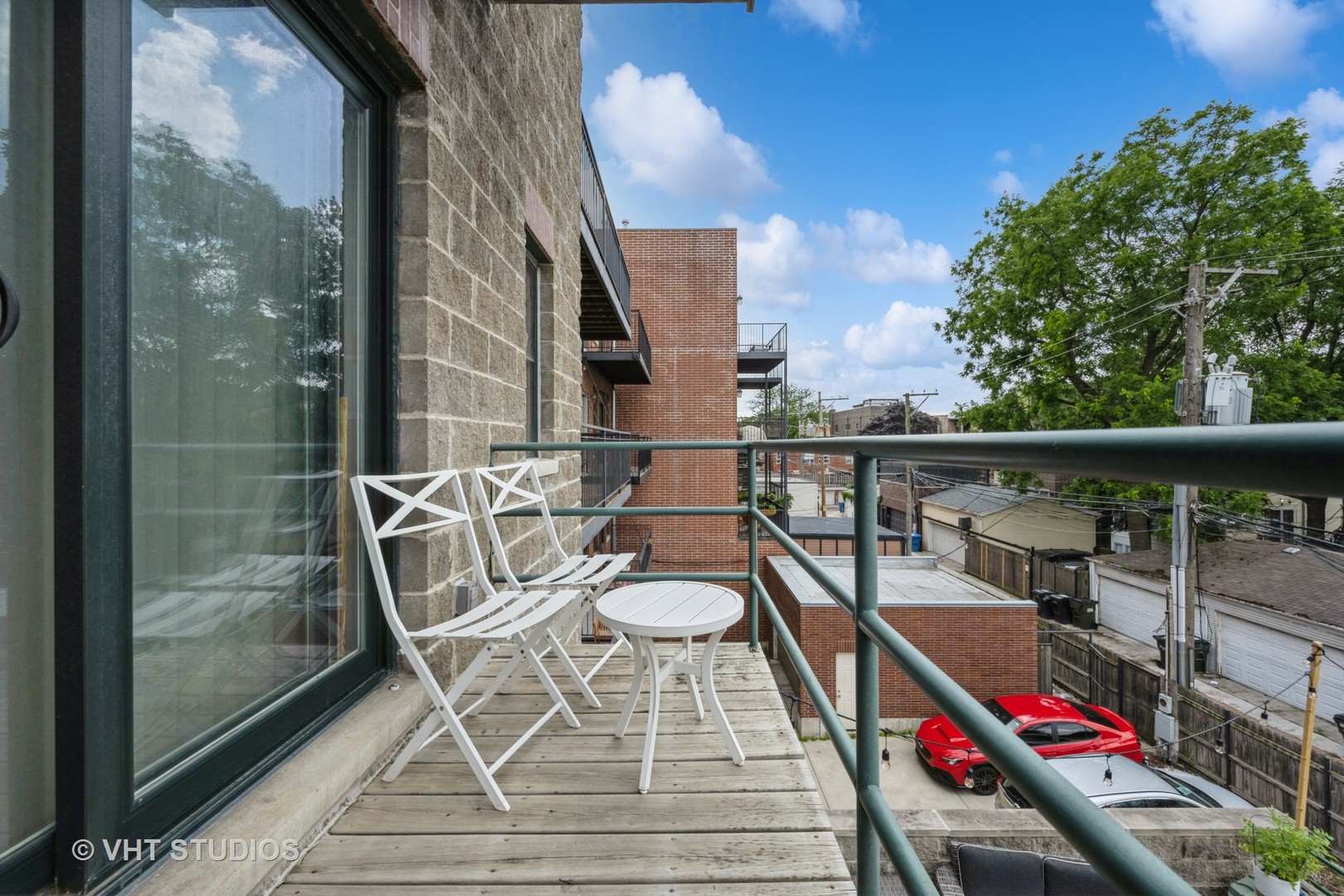 2632 North Halsted Street, Unit 3 Chicago, IL 60614 - Photo 13 of 14 a balcony with table and chairs