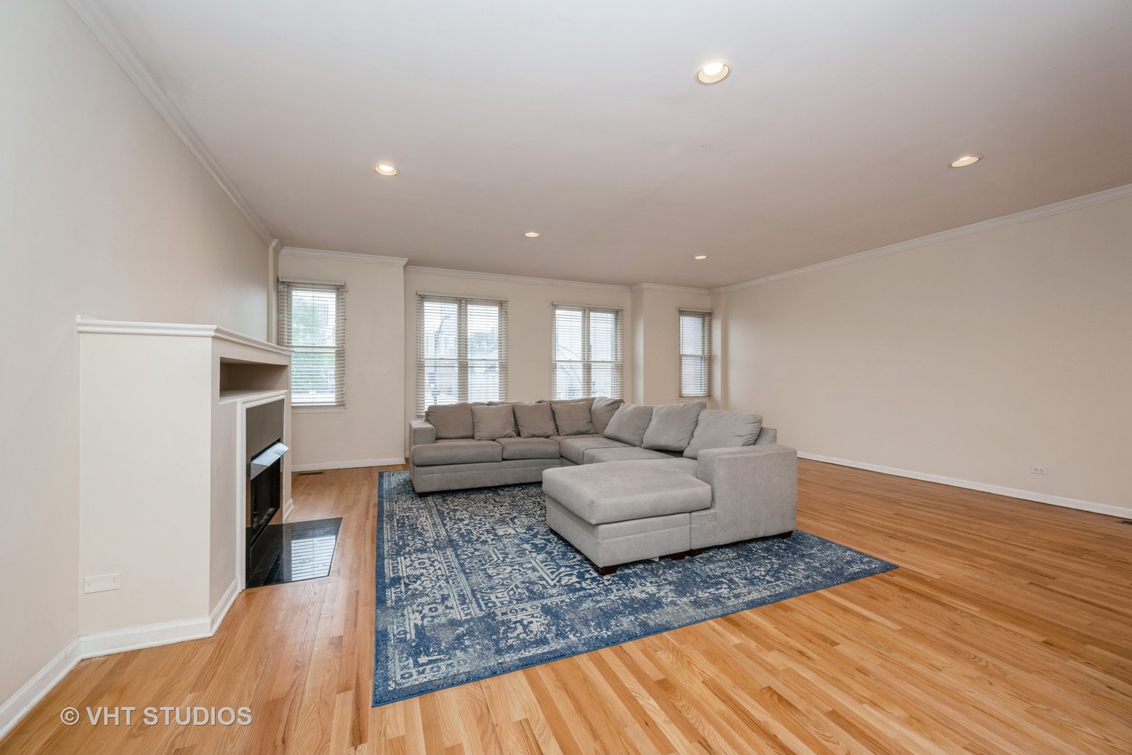 2632 North Halsted Street, Unit 3 Chicago, IL 60614 - Photo 2 of 14 a living room with furniture and a wooden floor