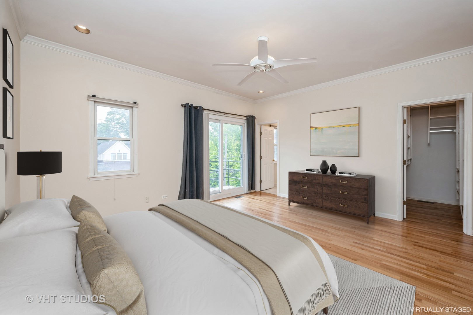 2632 North Halsted Street, Unit 3 Chicago, IL 60614 - Photo 7 of 14 a spacious bedroom with a large bed and a chandelier