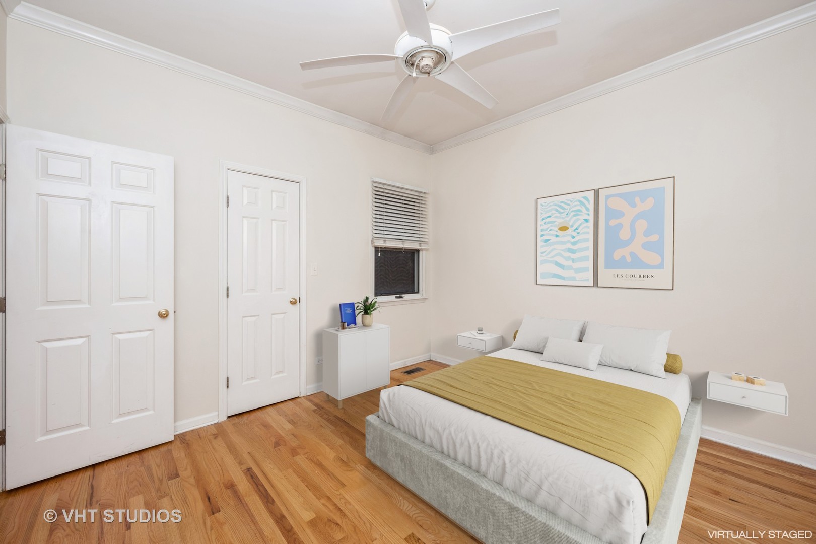 2632 North Halsted Street, Unit 3 Chicago, IL 60614 - Photo 8 of 14 a bedroom with a bed and a chandelier