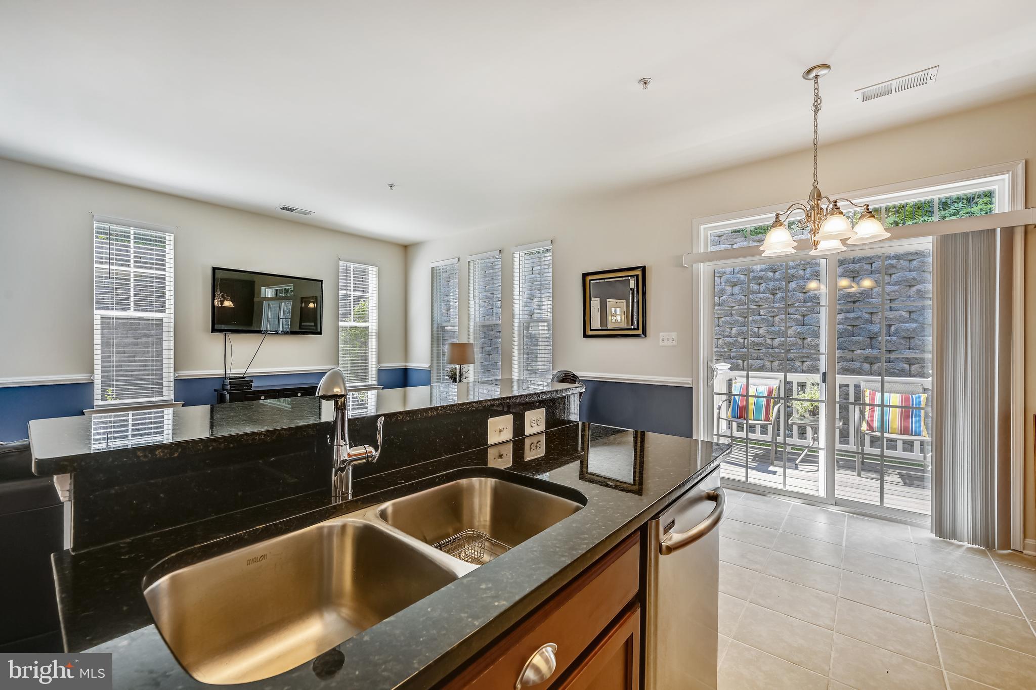 105 Jacobia Drive, Unit E4 Pasadena, MD 21122 - Photo 13 of 36 Sliders lead to deck