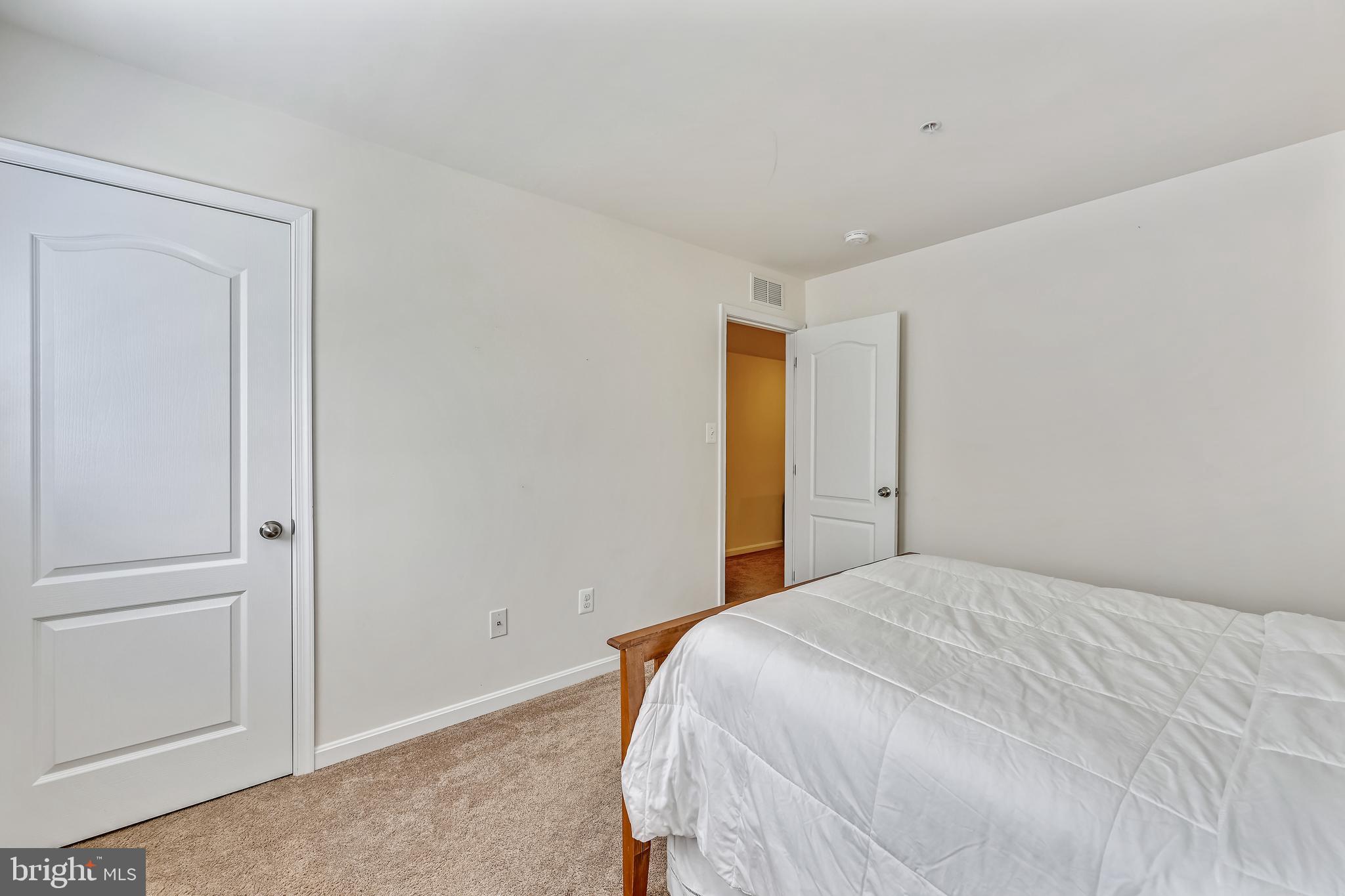 105 Jacobia Drive, Unit E4 Pasadena, MD 21122 - Photo 22 of 36 Upper level bedroom 1