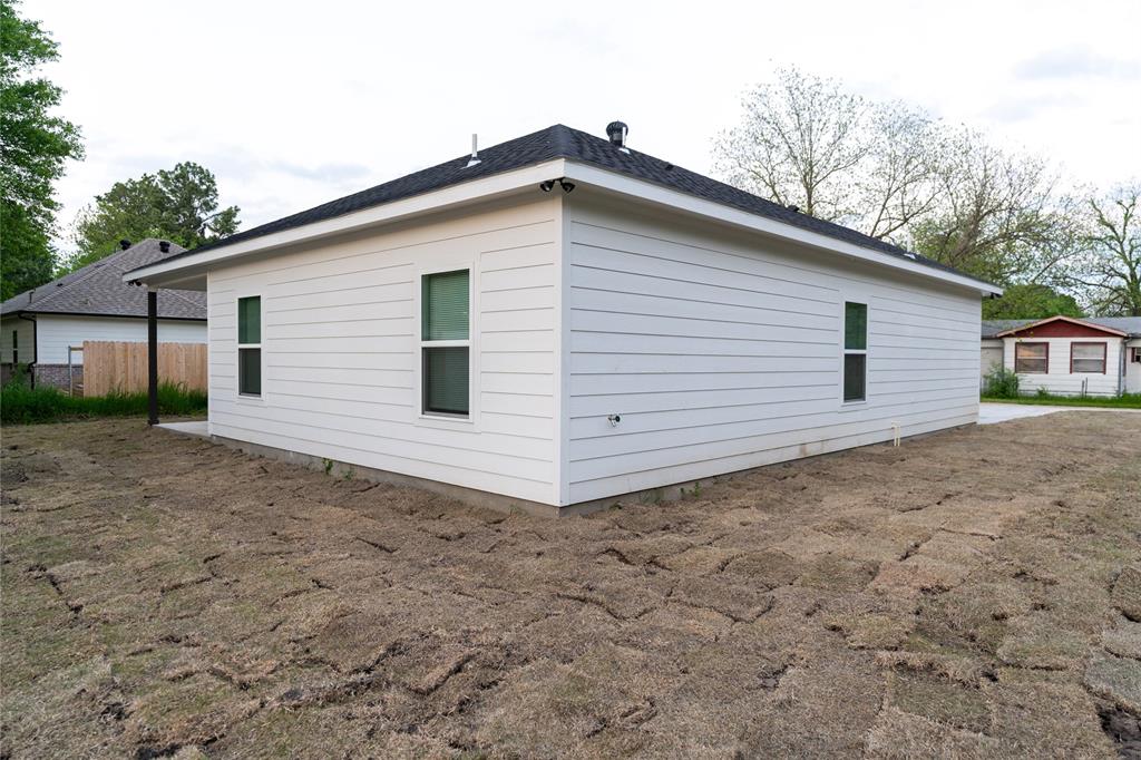 839 Southwest 7th Street Cooper, TX 75432 - Photo 15 of 21 View of side of home with fence