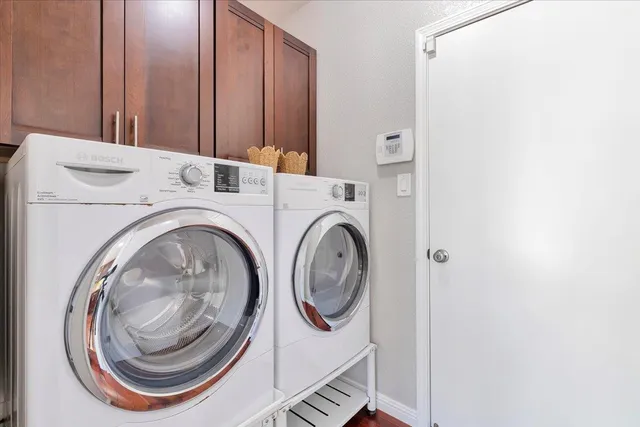 a utility room with dryer and washer