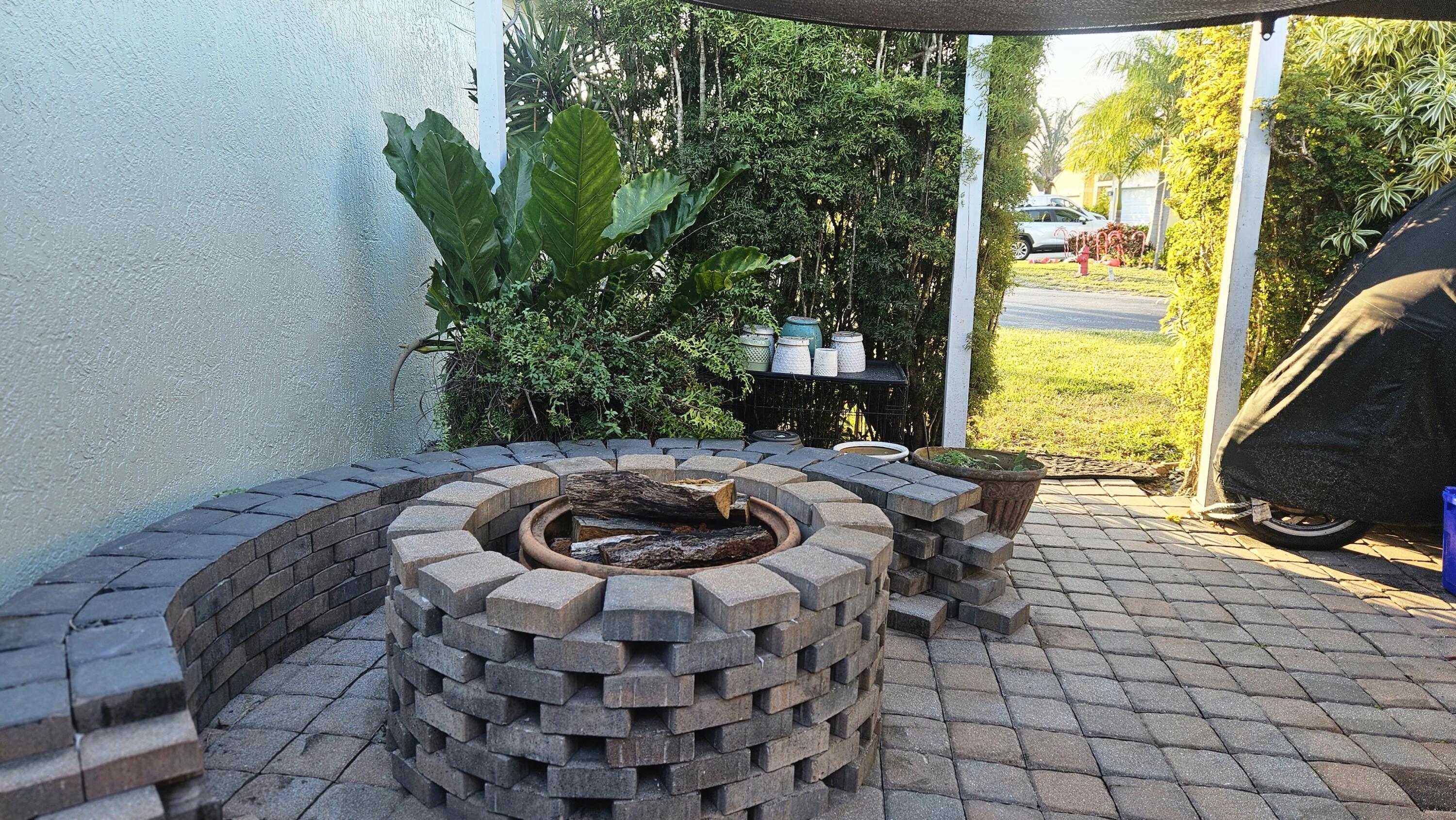 1768 Sawgrass Circle Greenacres, FL 33413 - Photo 13 of 40 a living room with furniture and a flat screen tv