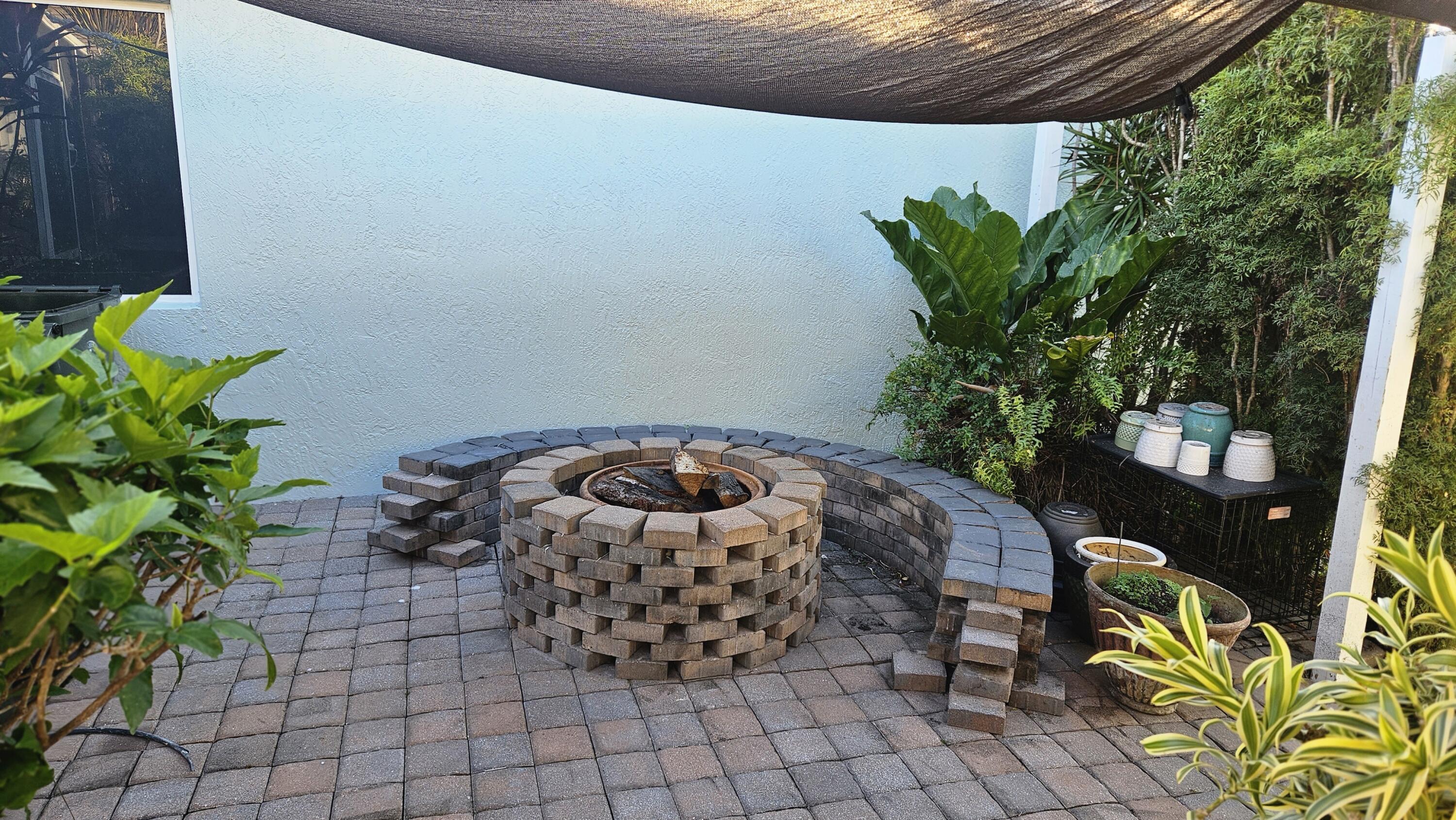 1768 Sawgrass Circle Greenacres, FL 33413 - Photo 14 of 40 a view of a chairs and table in a patio