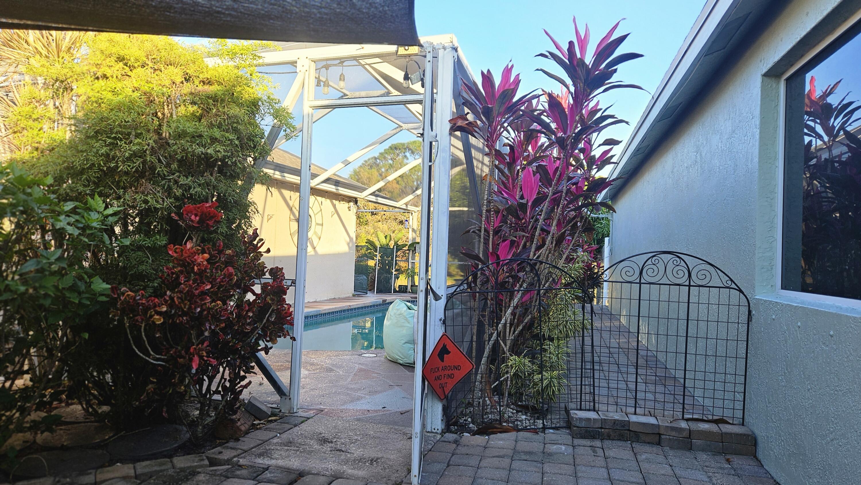 1768 Sawgrass Circle Greenacres, FL 33413 - Photo 15 of 40 a front view of a house with garden