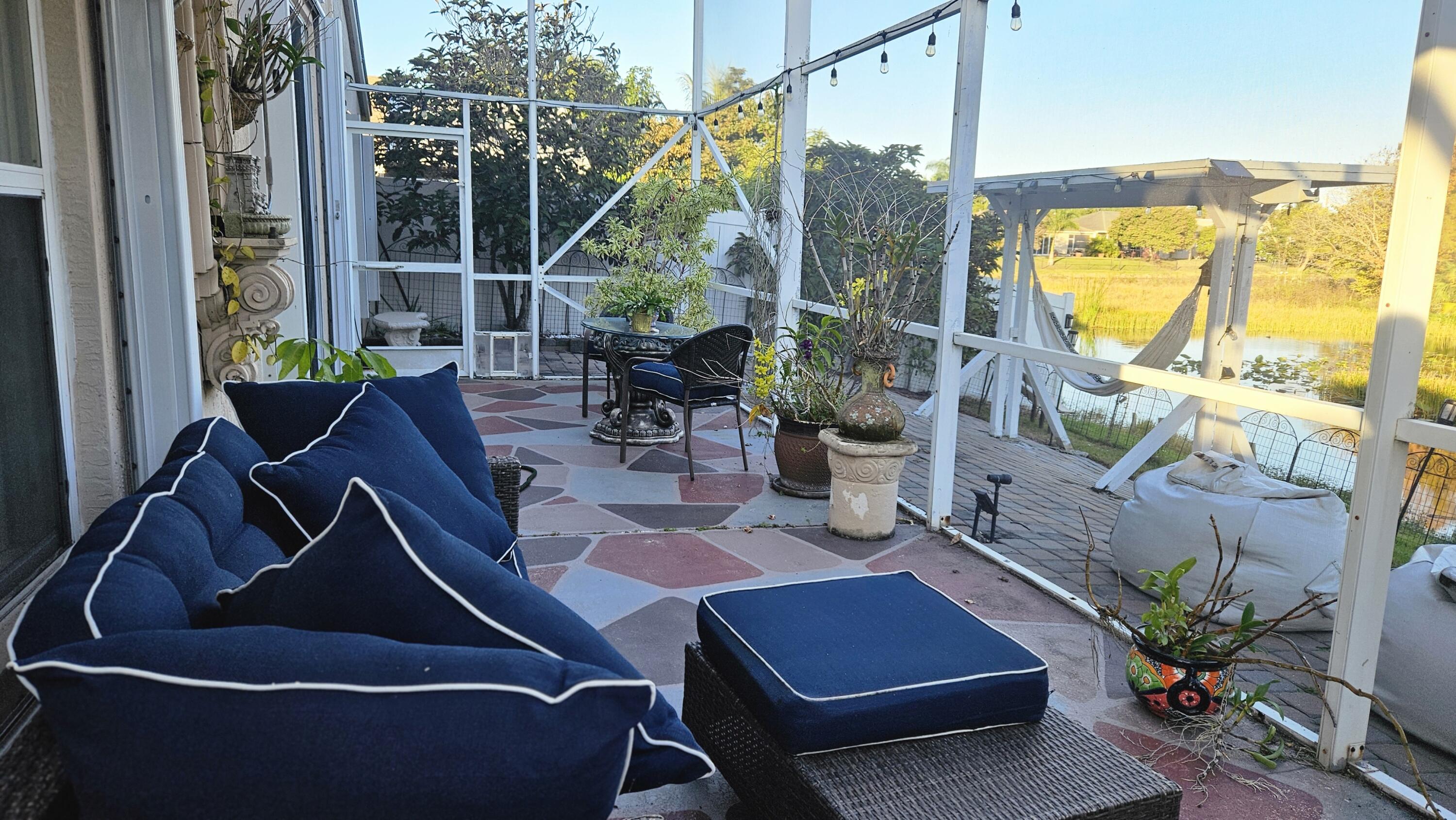 1768 Sawgrass Circle Greenacres, FL 33413 - Photo 16 of 40 a view of an outdoor sitting area