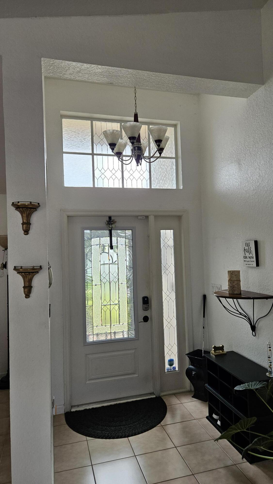 1768 Sawgrass Circle Greenacres, FL 33413 - Photo 17 of 40 a view of a entryway of a house