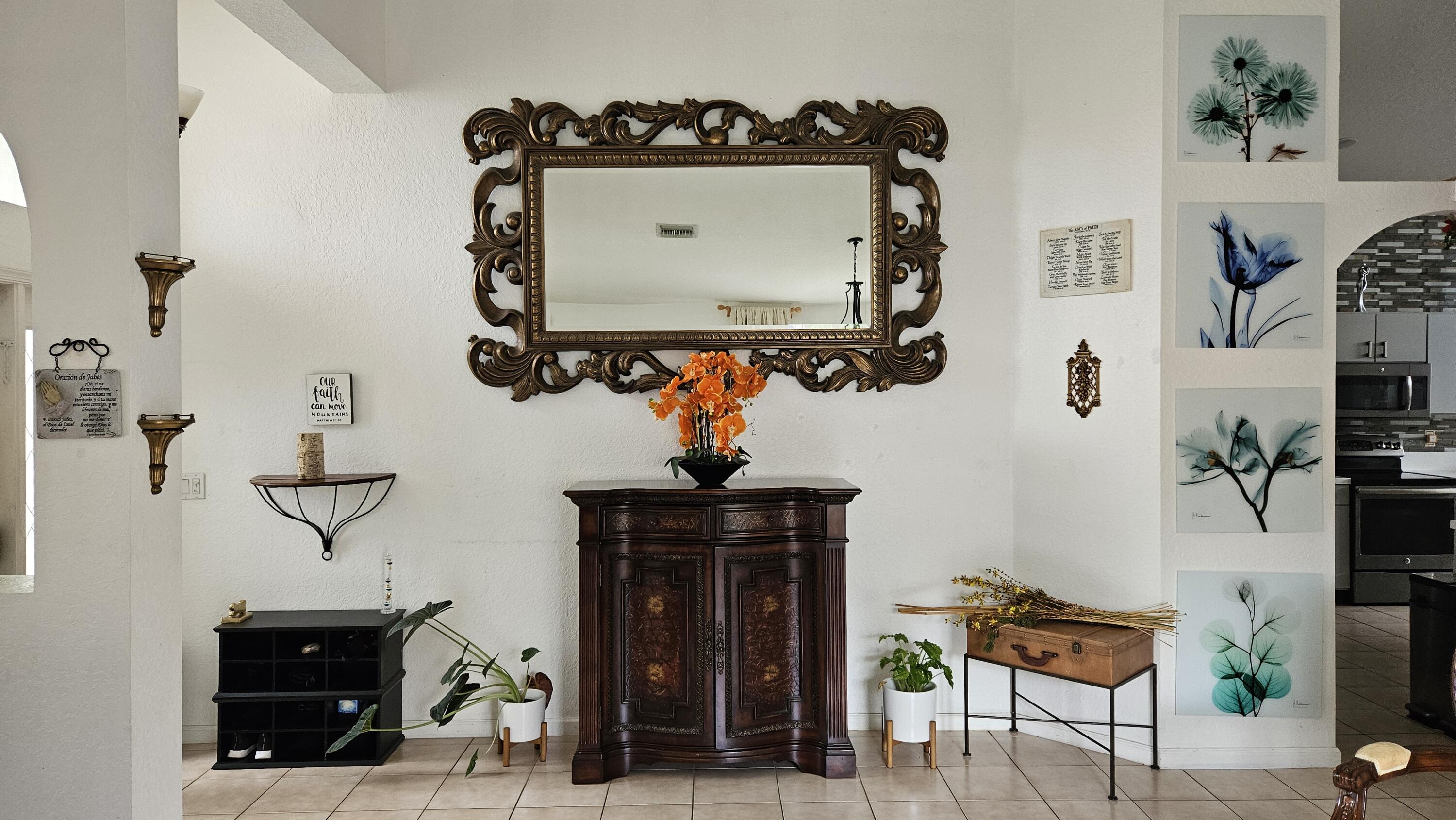 1768 Sawgrass Circle Greenacres, FL 33413 - Photo 20 of 40 a living room with furniture and a potted plant