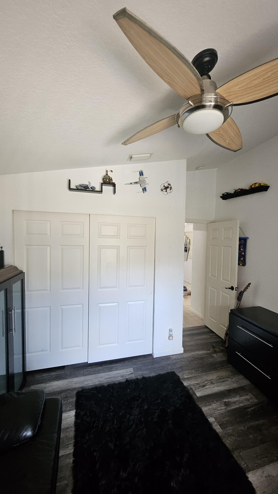 1768 Sawgrass Circle Greenacres, FL 33413 - Photo 29 of 40 a view of entryway and hall with a wooden floor