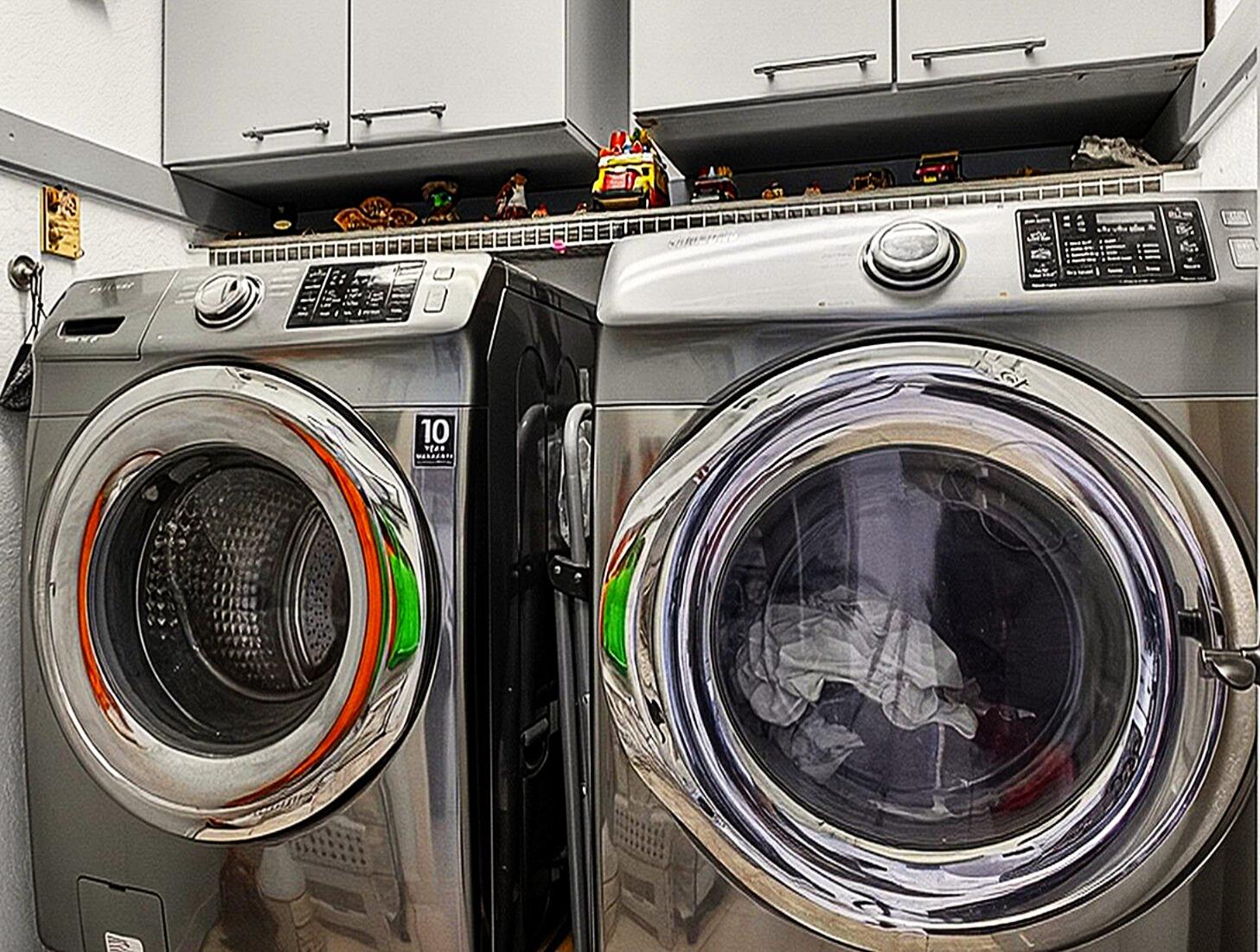 1768 Sawgrass Circle Greenacres, FL 33413 - Photo 33 of 40 a utility room with dryer and washer