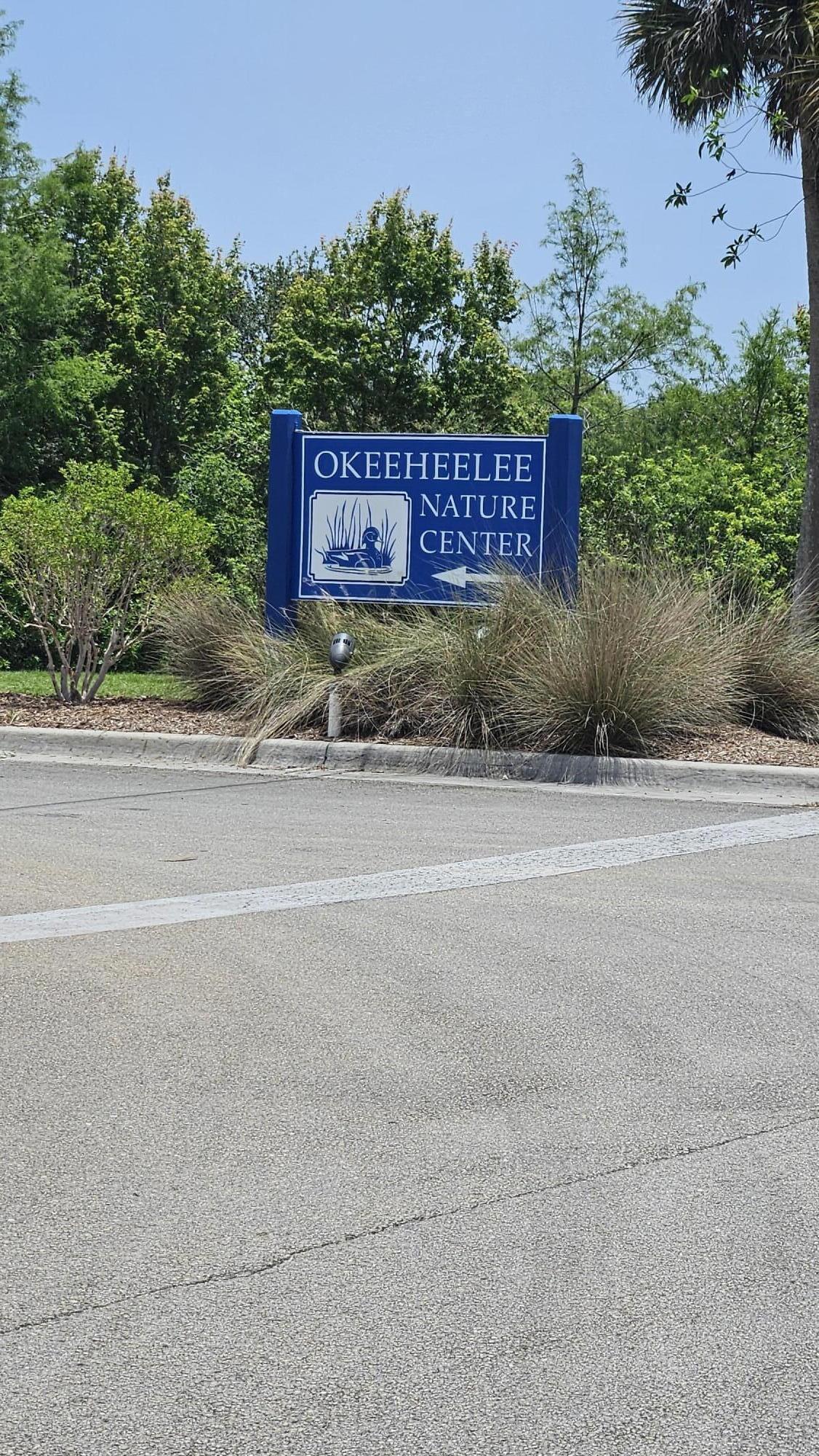 1768 Sawgrass Circle Greenacres, FL 33413 - Photo 38 of 40 a sign that is on the side of a building