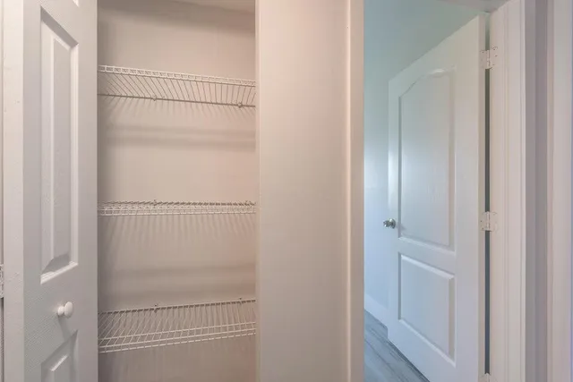 a bathroom with a glass shower door