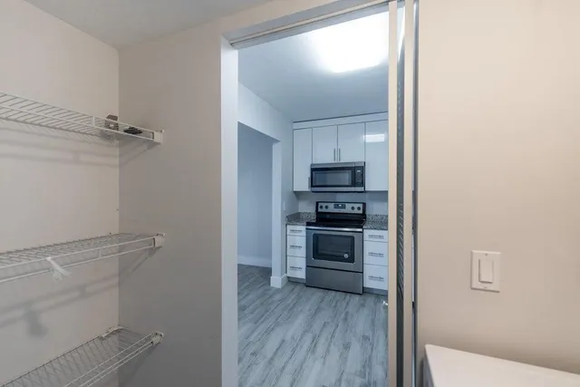 a view of kitchen with microwave and stove