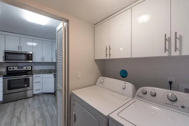 a kitchen with a sink a stove and cabinets
