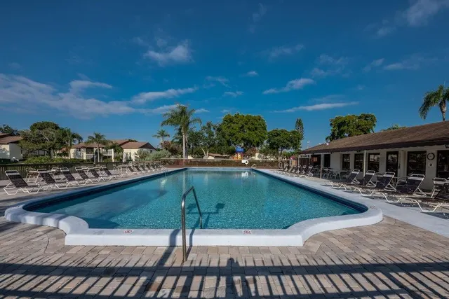 a table and chairs sitting in the roof of a house