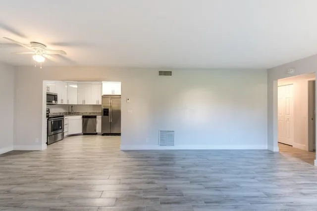 a view of kitchen with wooden floor