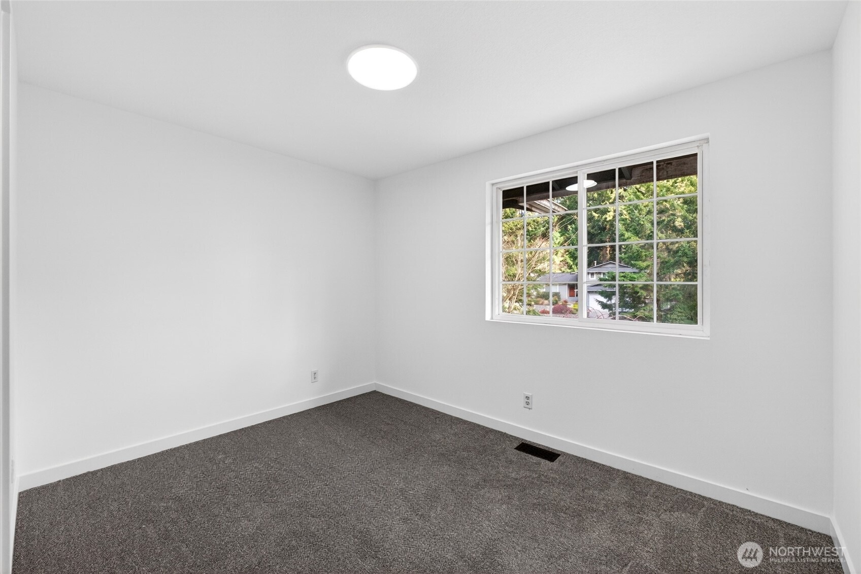 19010 63rd Street East Lake Tapps, WA 98391 - Photo 12 of 32 an empty room with a window