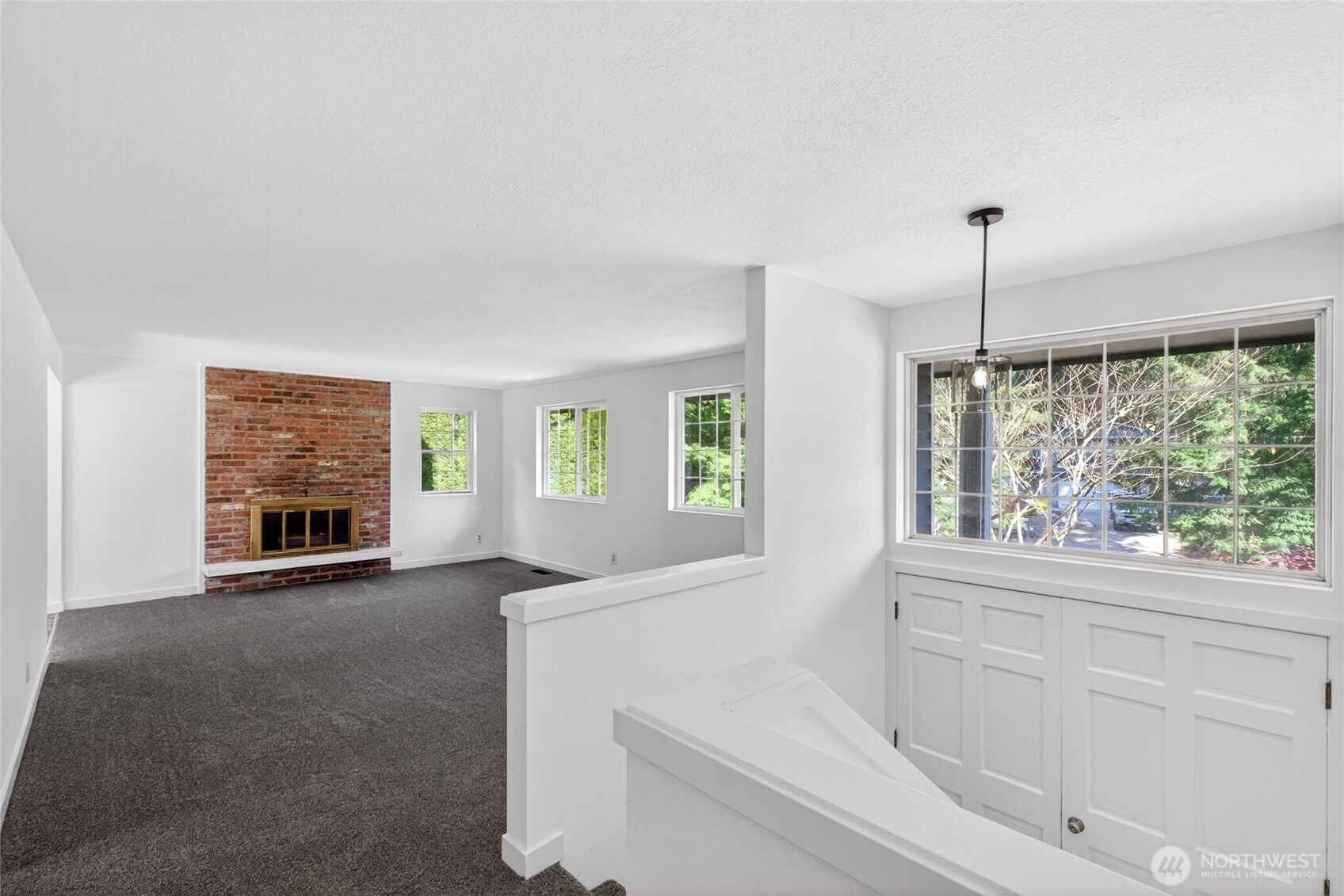 19010 63rd Street East Lake Tapps, WA 98391 - Photo 16 of 32 a view of an empty room with a fireplace and a window