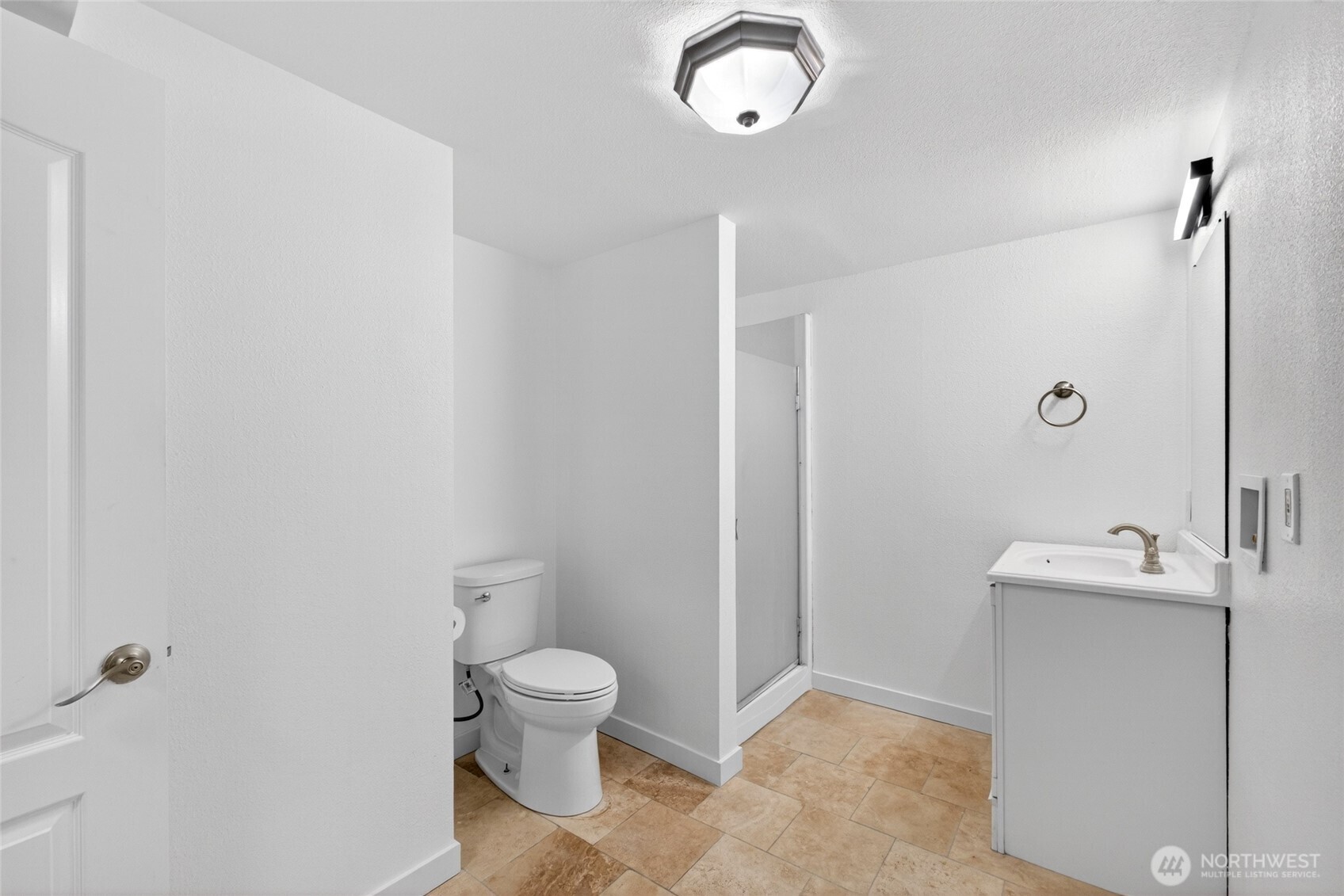 19010 63rd Street East Lake Tapps, WA 98391 - Photo 21 of 32 a bathroom with a toilet sink and shower