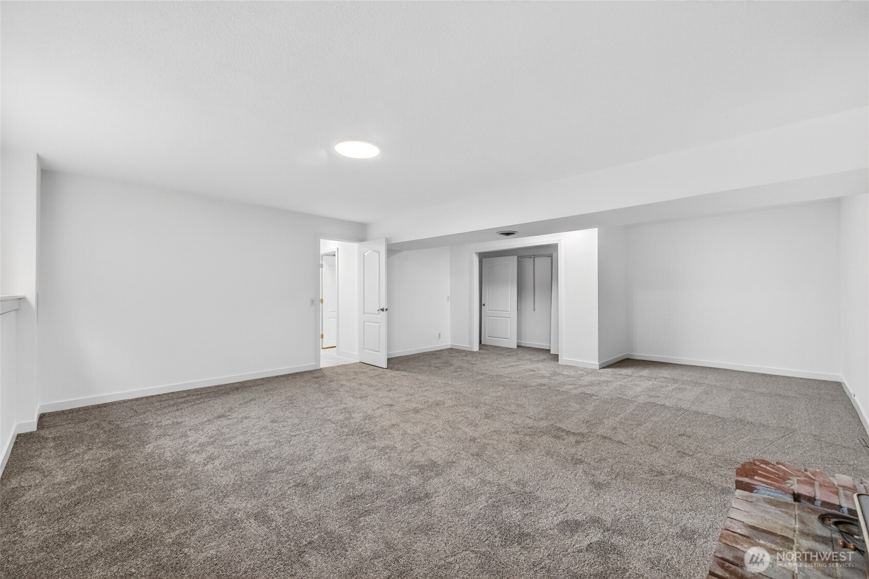 19010 63rd Street East Lake Tapps, WA 98391 - Photo 29 of 32 an empty room with a natural light