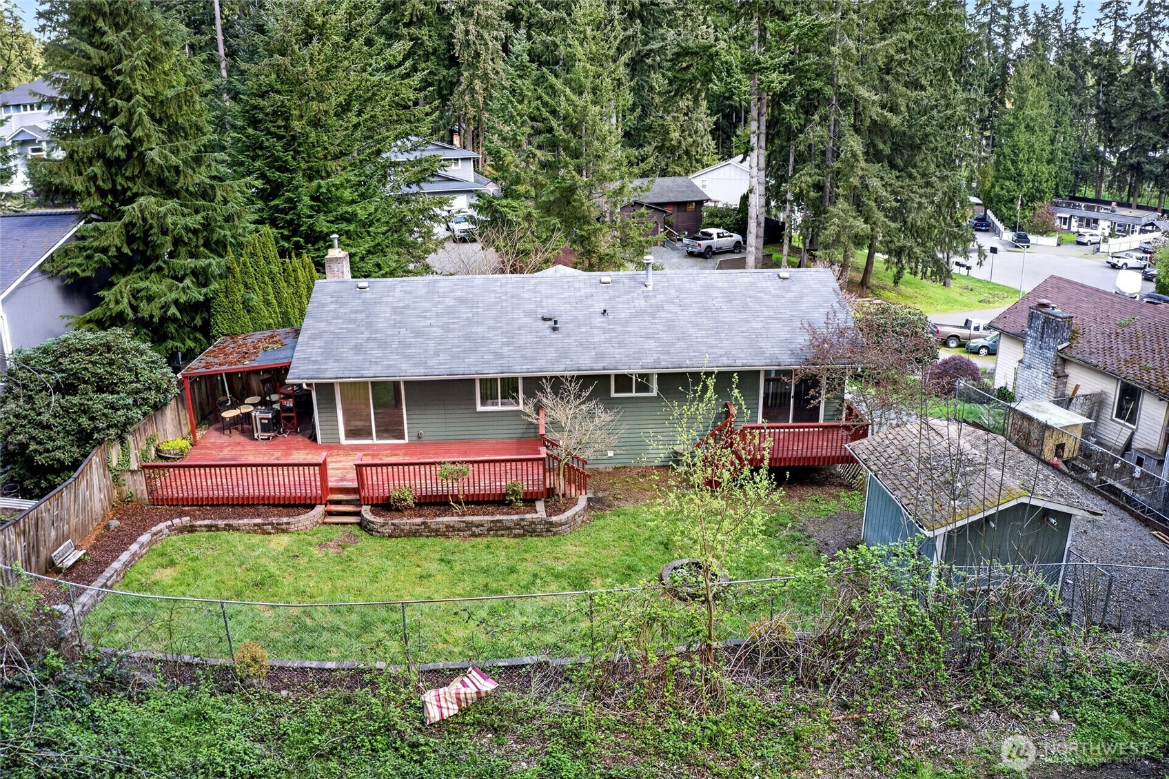 19010 63rd Street East Lake Tapps, WA 98391 - Photo 5 of 32 an aerial view of a house with table and chairs under an umbrella