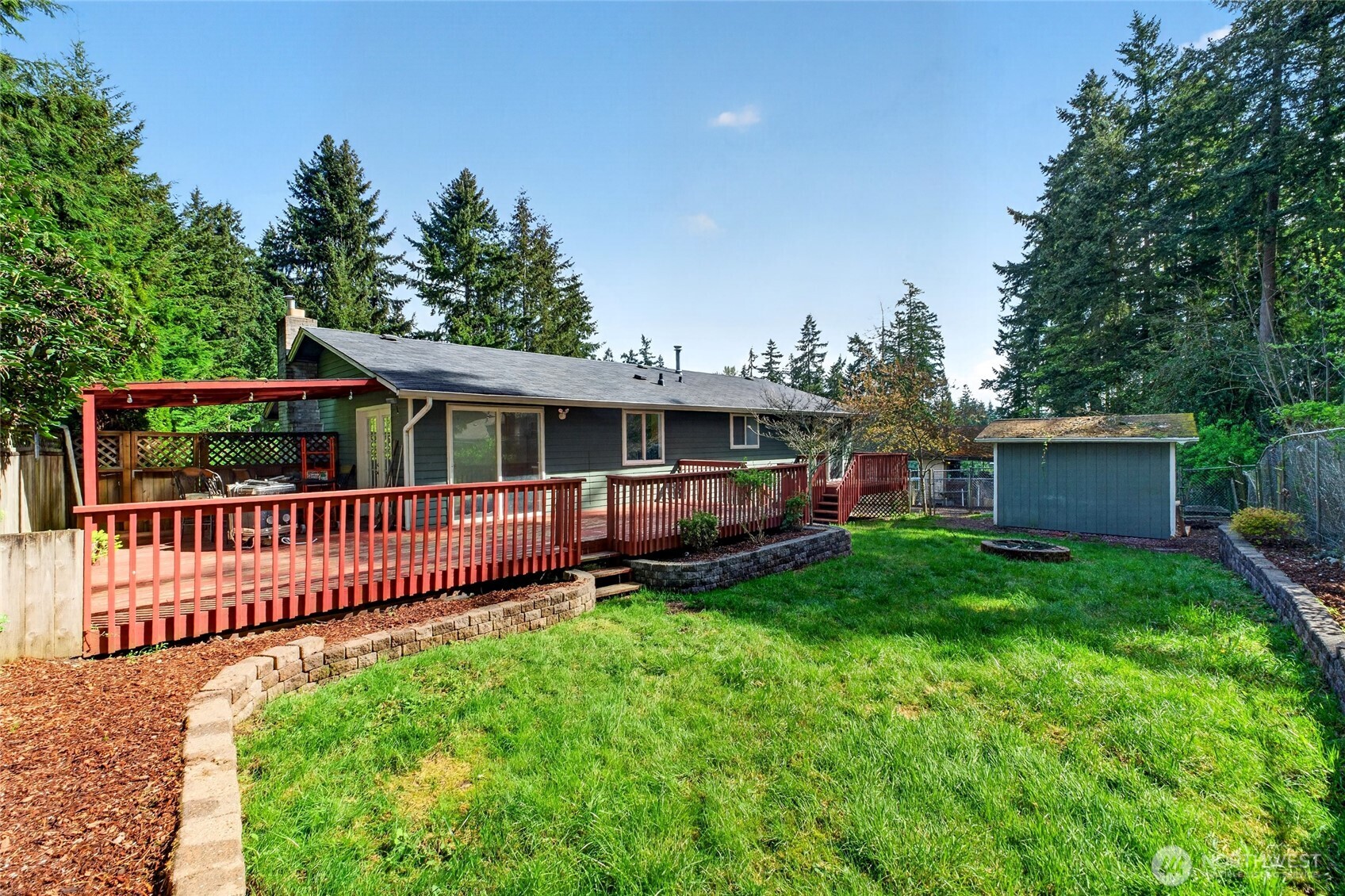 19010 63rd Street East Lake Tapps, WA 98391 - Photo 6 of 32 a view of a house with a yard and deck