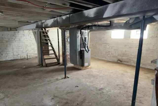 a front view of house with a garden