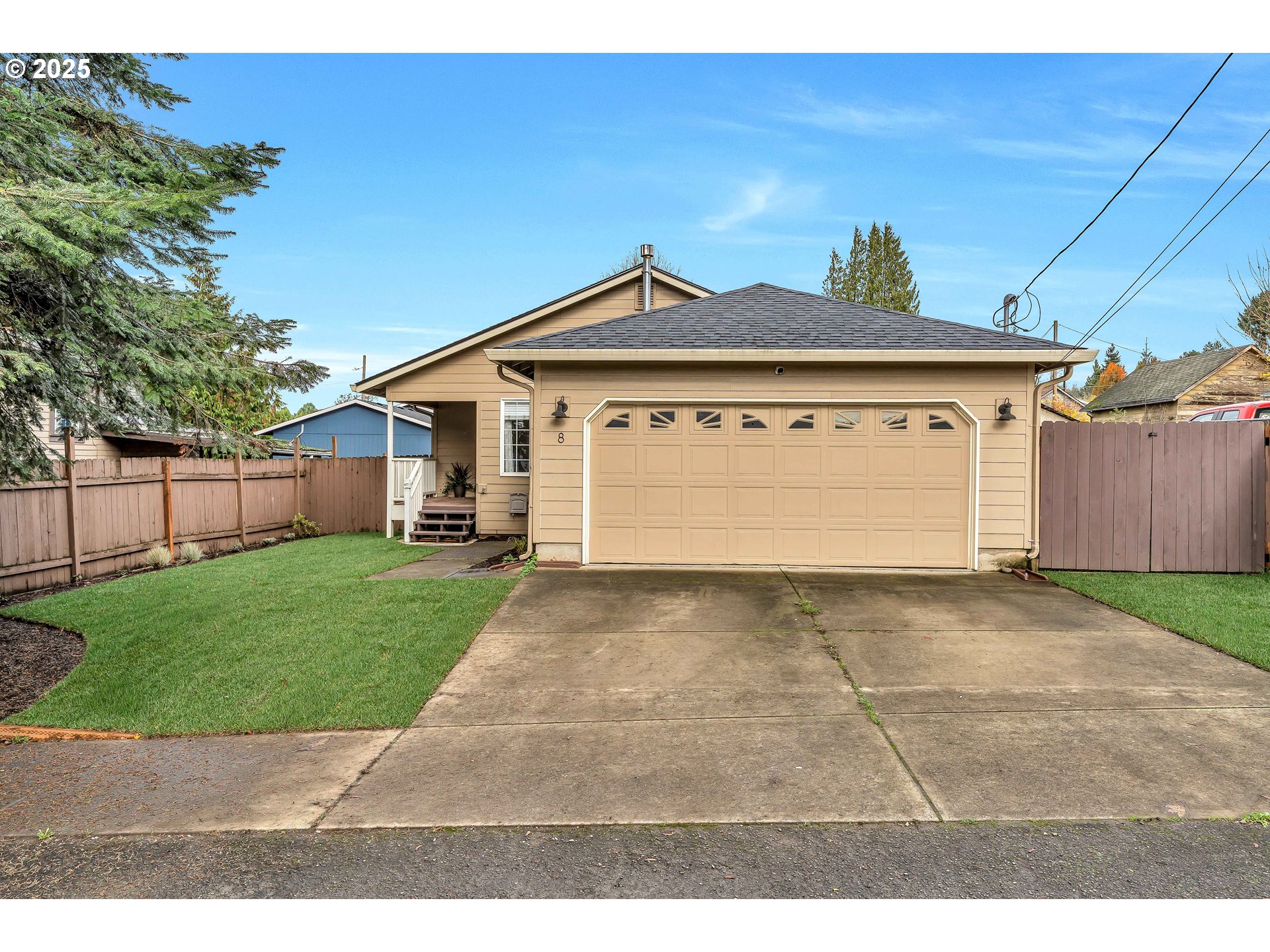 8 Elm Street Ridgefield, WA 98642 - Photo 1 of 33 a view of a grey house with a yard