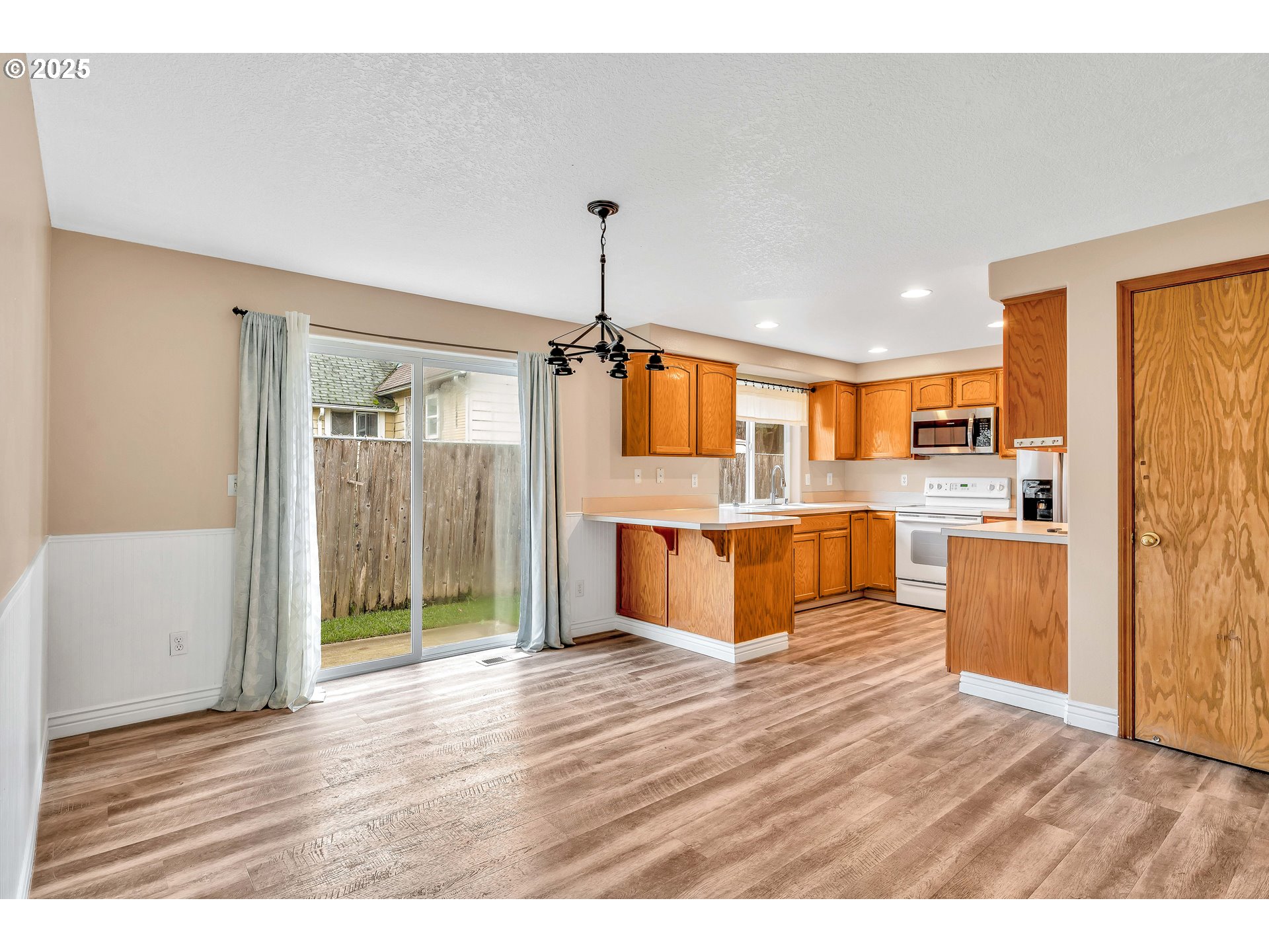 8 Elm Street Ridgefield, WA 98642 - Photo 11 of 33 a view of a kitchen with wooden floor