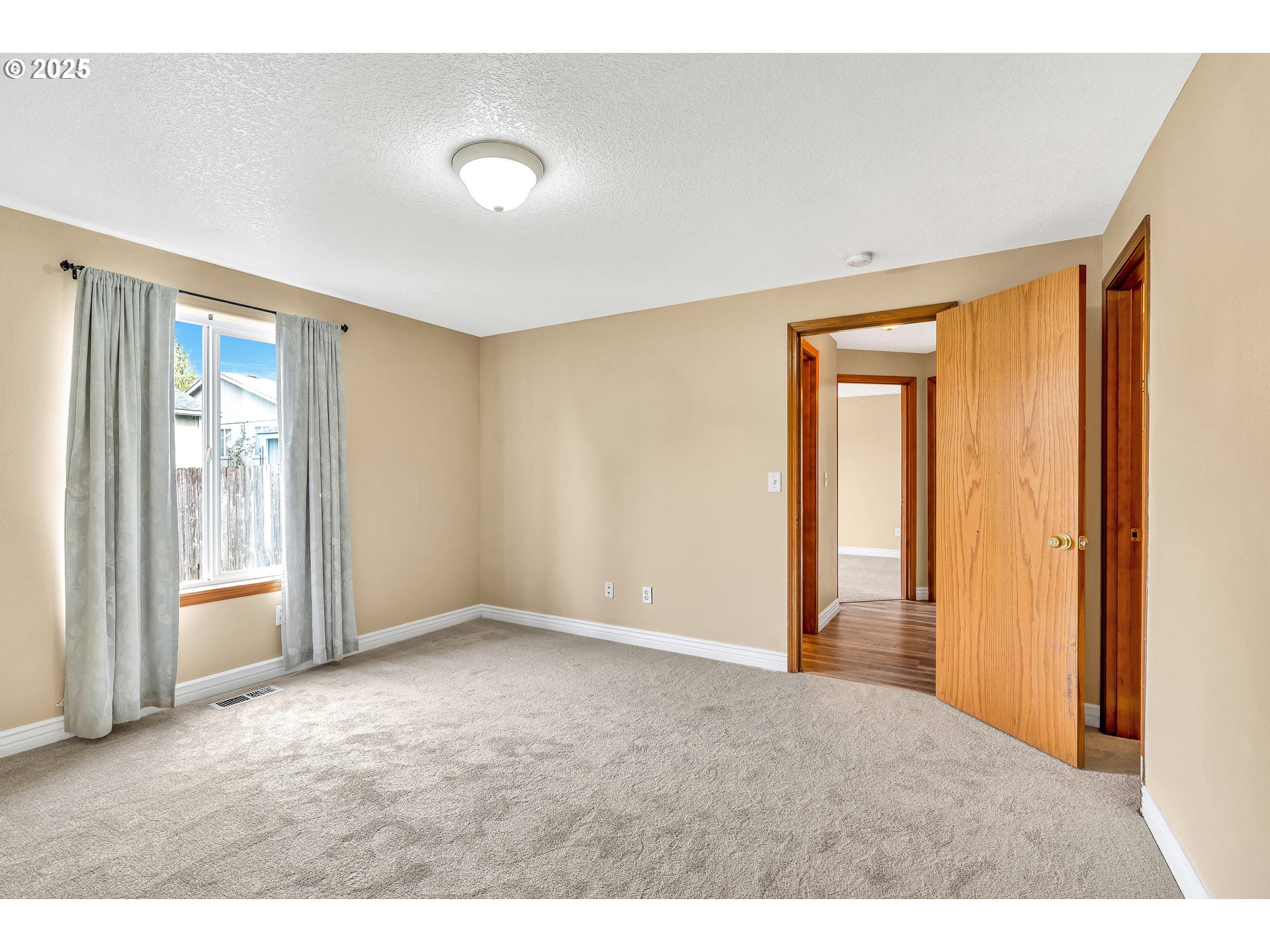 8 Elm Street Ridgefield, WA 98642 - Photo 18 of 33 a view of an empty room with glass door