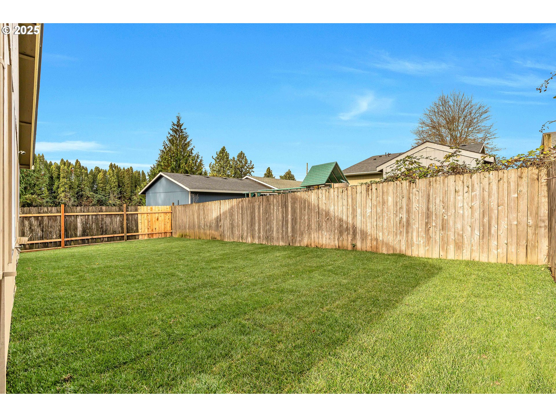 8 Elm Street Ridgefield, WA 98642 - Photo 27 of 33 a view of a backyard with a garden