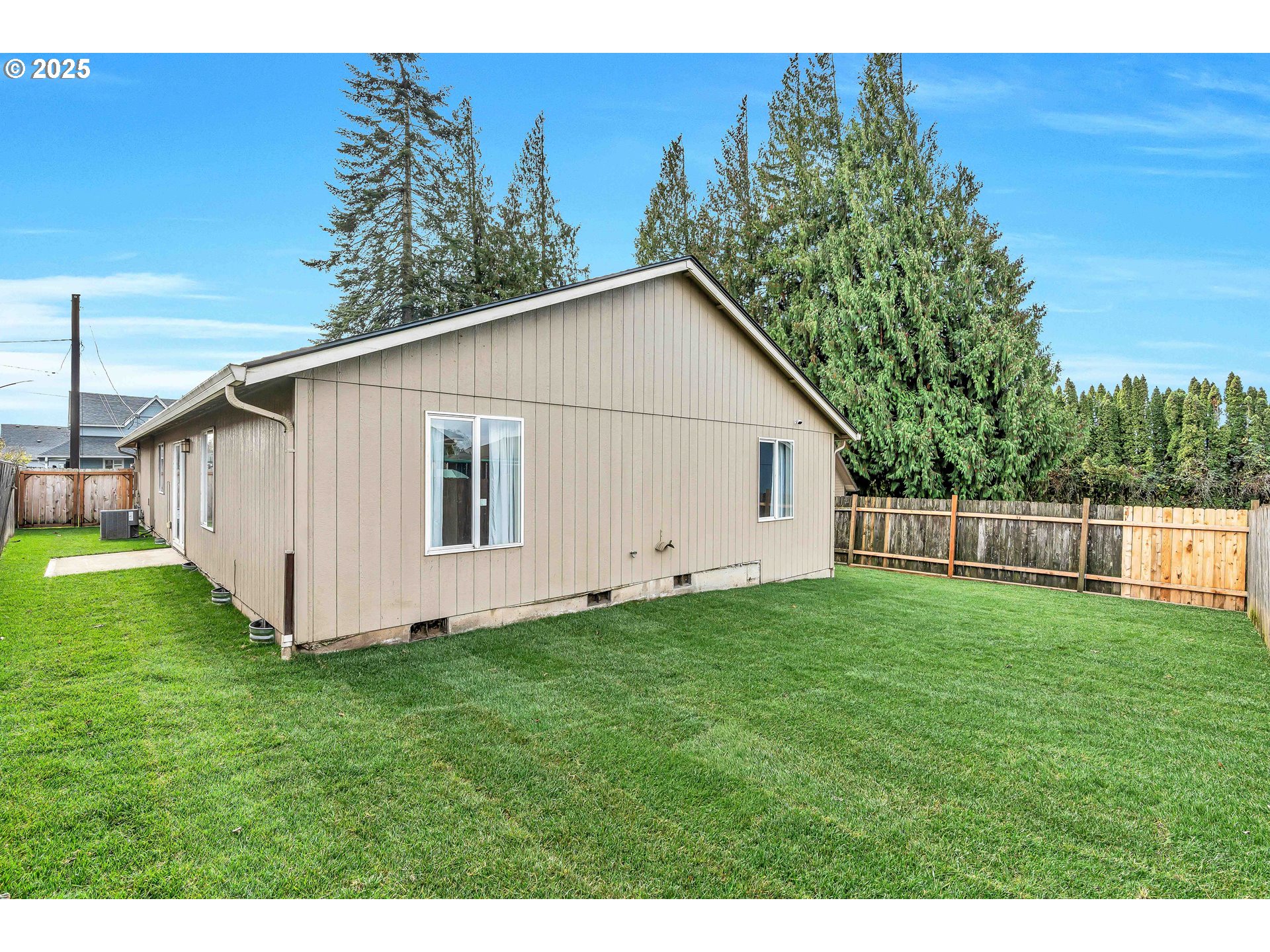 8 Elm Street Ridgefield, WA 98642 - Photo 28 of 33 a view of a backyard with barn and a small yard