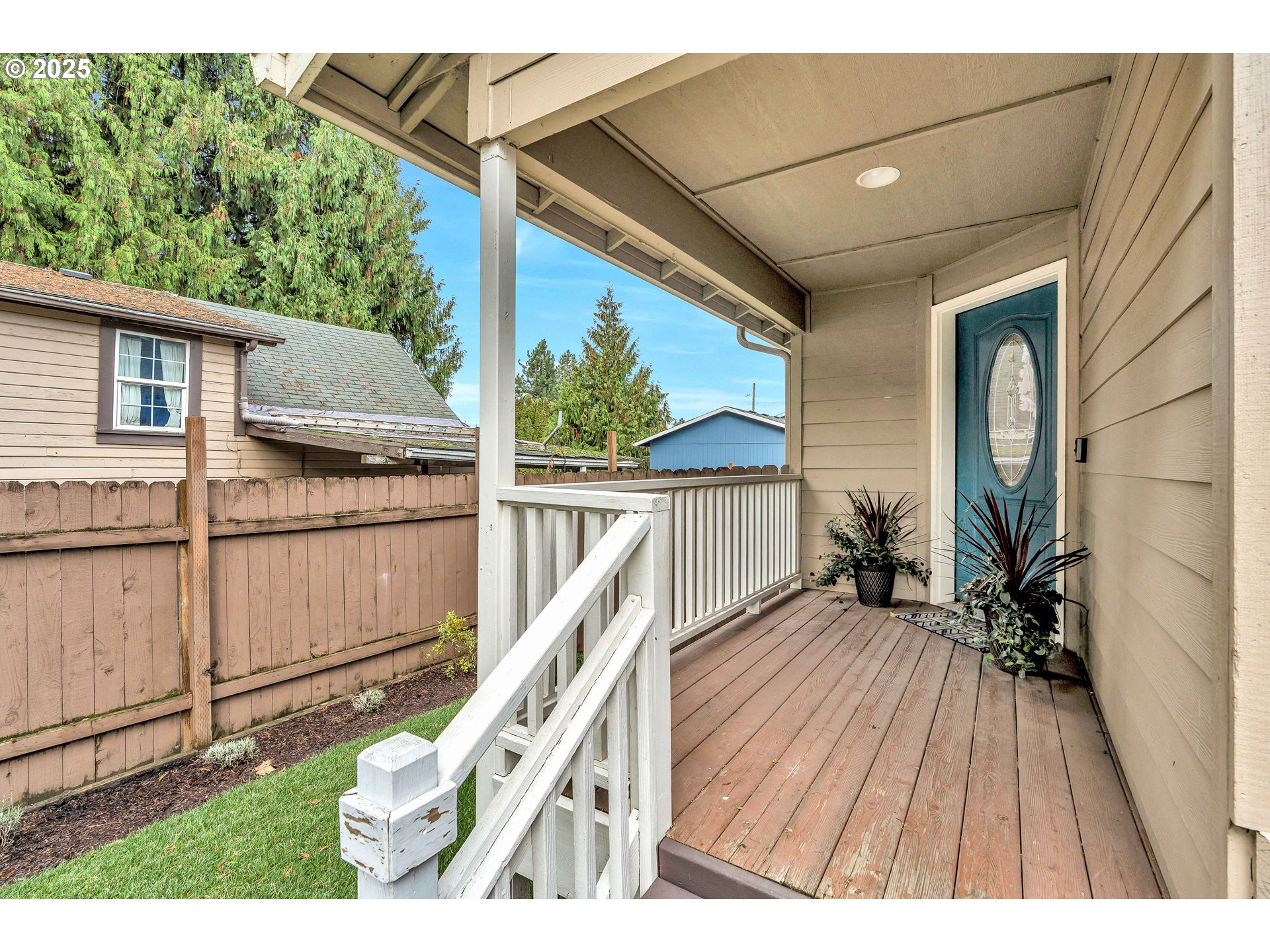 8 Elm Street Ridgefield, WA 98642 - Photo 3 of 33 a balcony with wooden floor and furniture