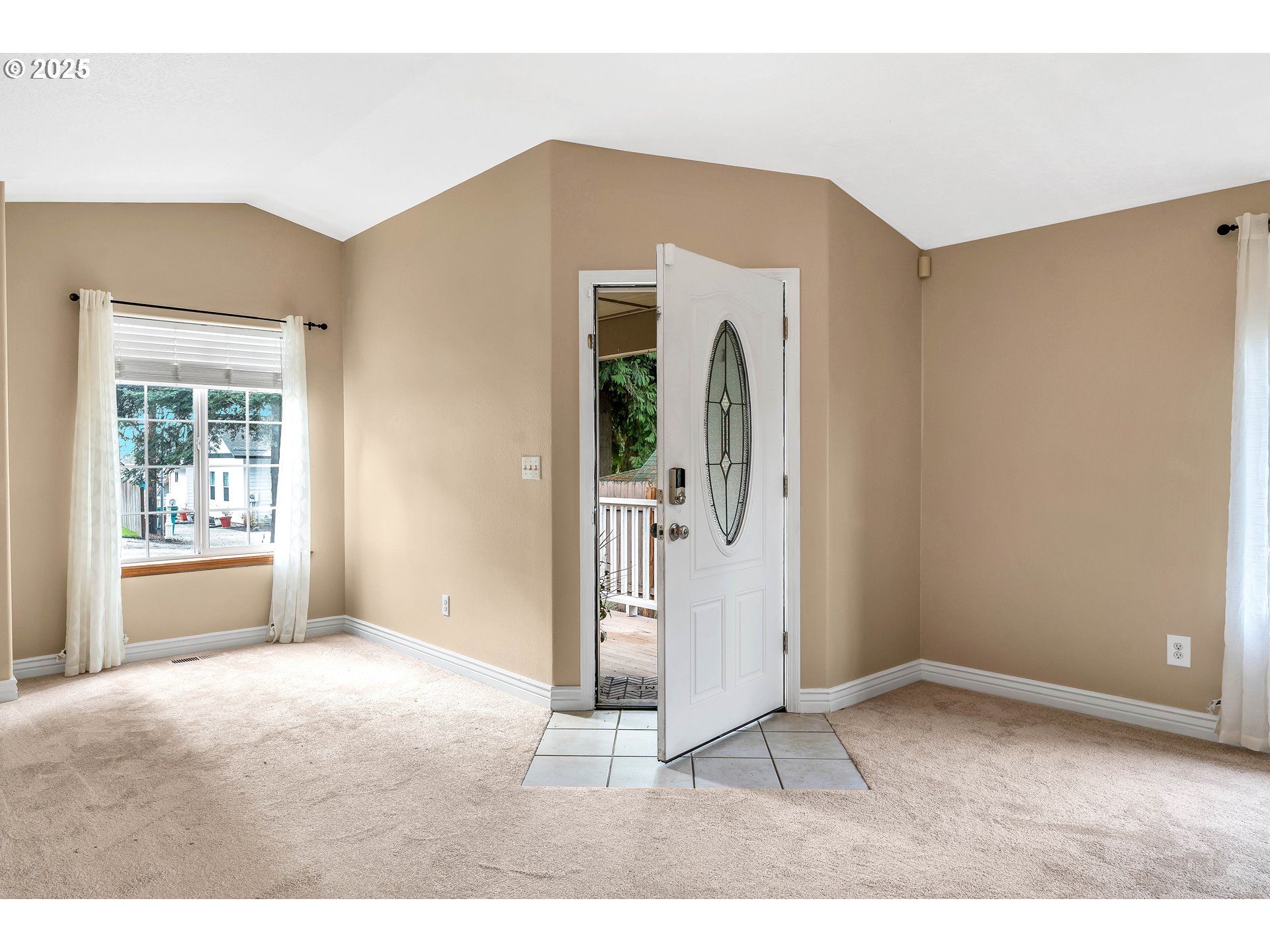 8 Elm Street Ridgefield, WA 98642 - Photo 5 of 33 a view of a big room with windows and entryway