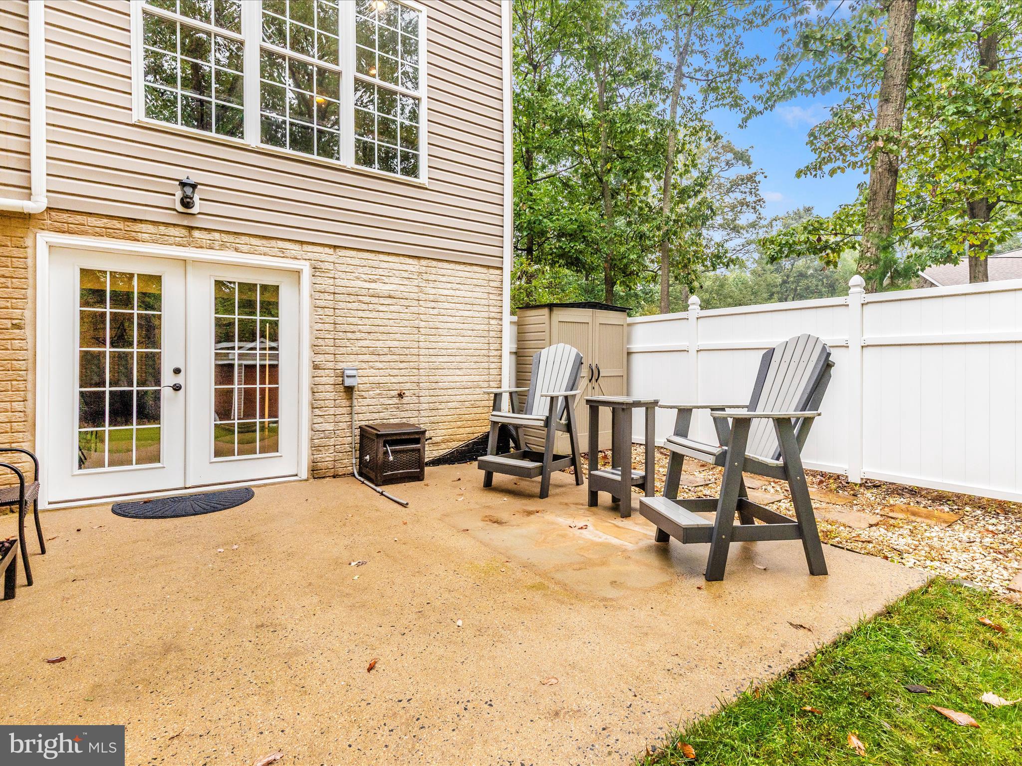 10027 Pine Tree Road Woodsboro, MD 21798 - Photo 77 of 81 a view of a patio with table and chairs and floor to ceiling window