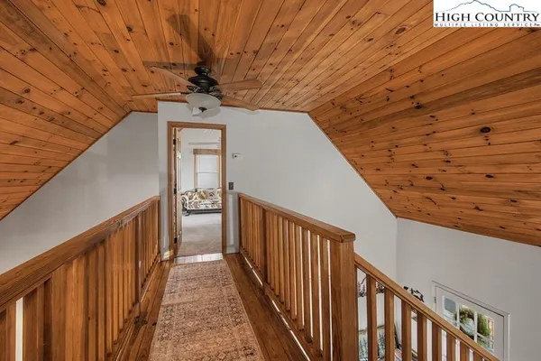 a view of a balcony with wooden floor