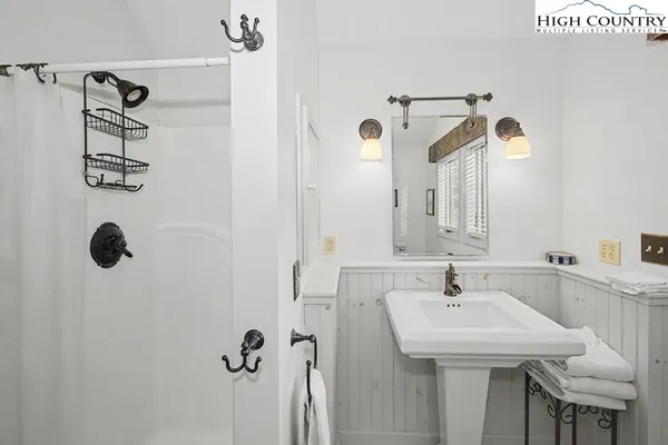 a bathroom with a sink and mirror