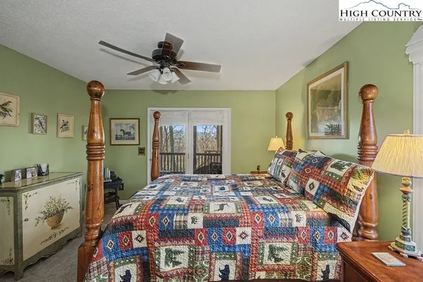 a bedroom with a bed and a mirror