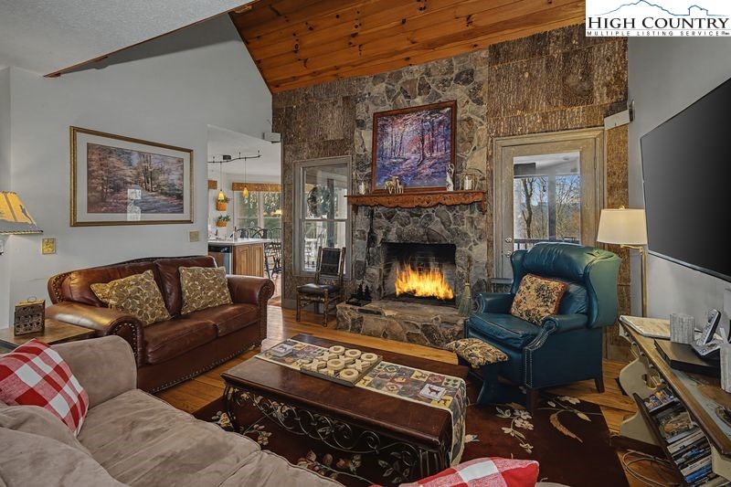 137 Granny's Ridge Road Ferguson, NC 28624 - Photo 3 of 27 a living room with furniture and a fireplace