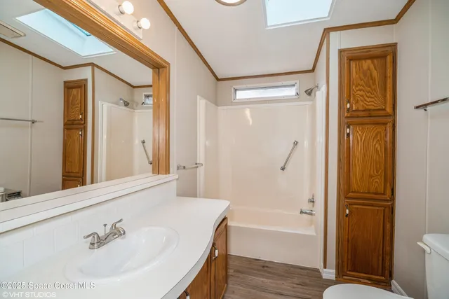 a bathroom with a tub and a sink
